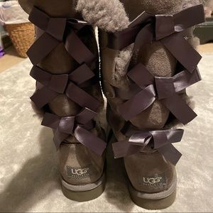 Gray suede UGG boots with back bows